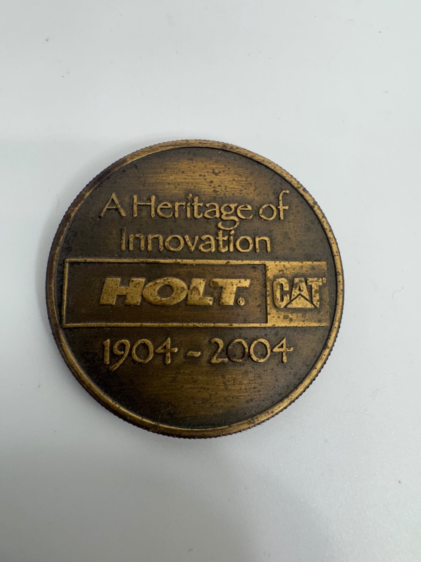 Holt CAT 100 year anniversary coin