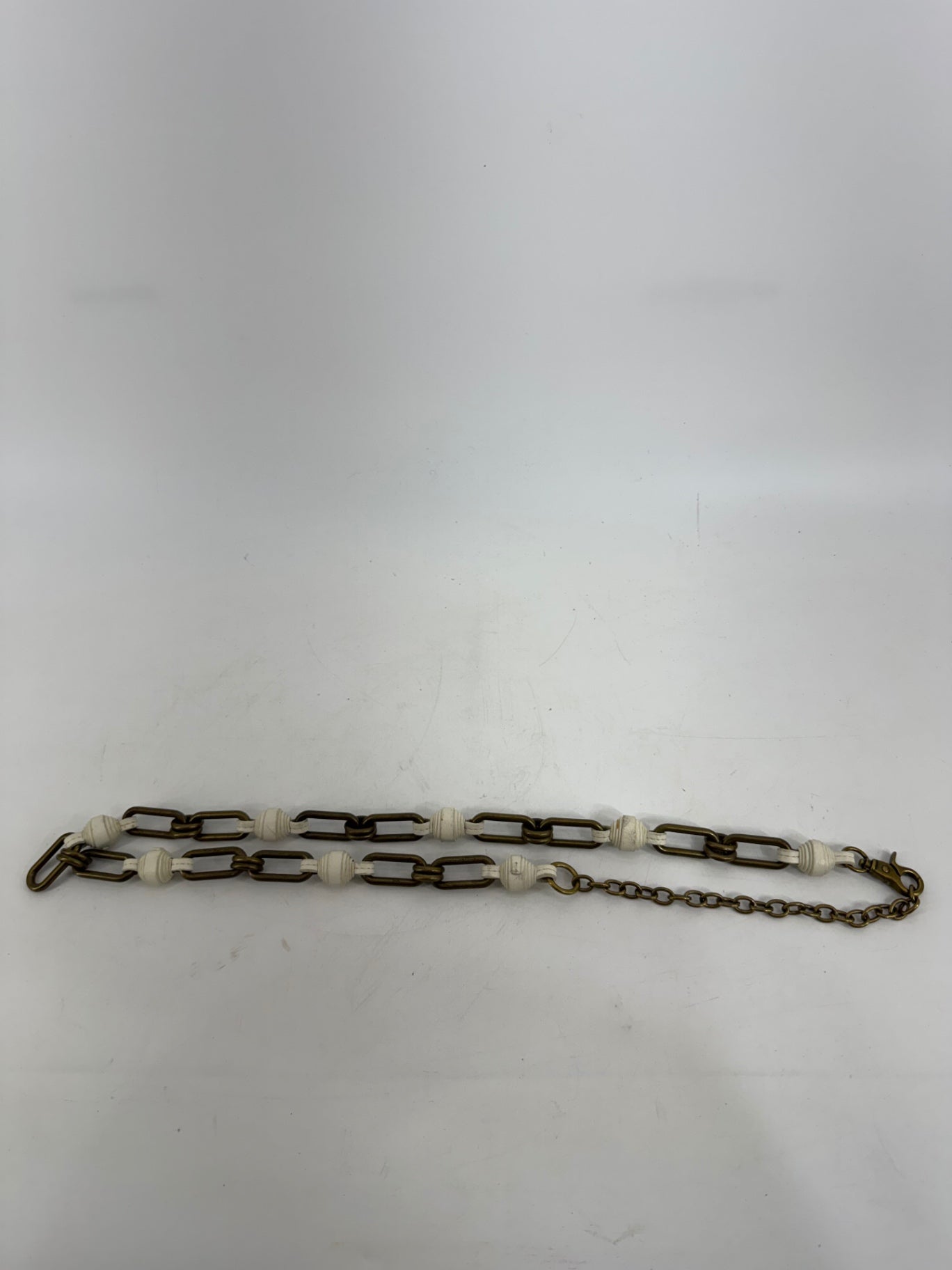 Fossil Chain and White Leather Belt